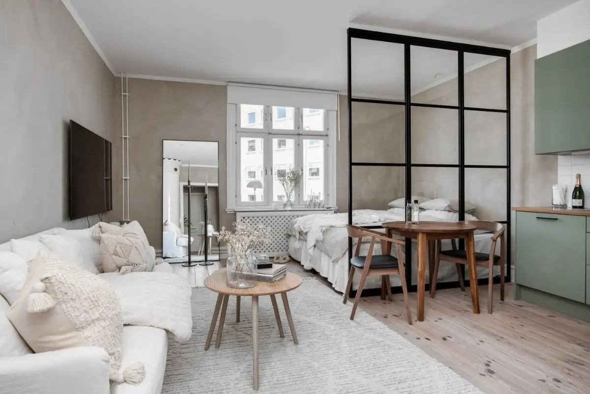 Studio Apartment Layout Ideas: Living Small is Looking Good 11 studio-apartment-layout-bed-next-to-kitchen-sofa-opposite-side-nordroom