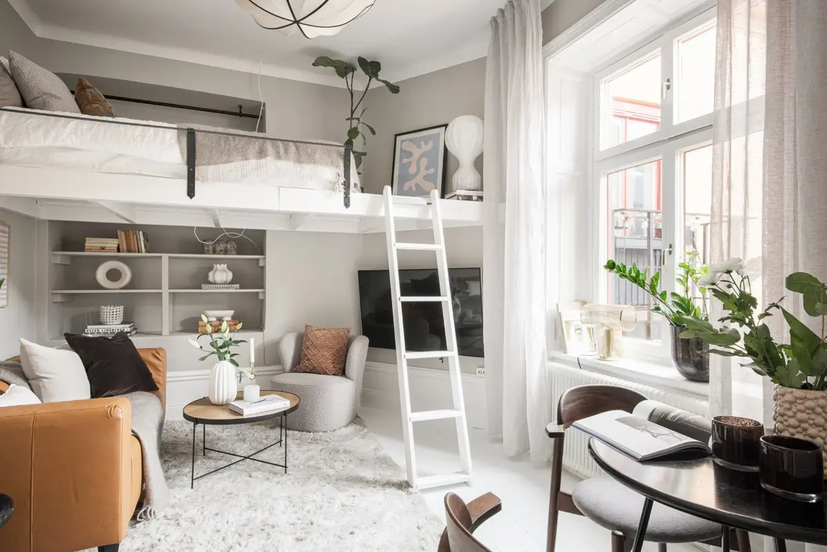 Studio Apartment Layout Ideas: Living Small is Looking Good 39 studio layout loft bed above sitting area nordroom Studio Apartment Layout Ideas: Living Small is Looking Good