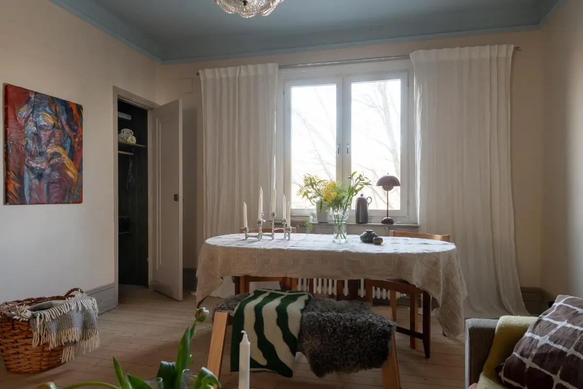 Preserved Details and a Warm Yellow Kitchen in a 1920s Apartment 16 yellow-kitchen-light-blue-living-room-ceiling-swedish-apartment