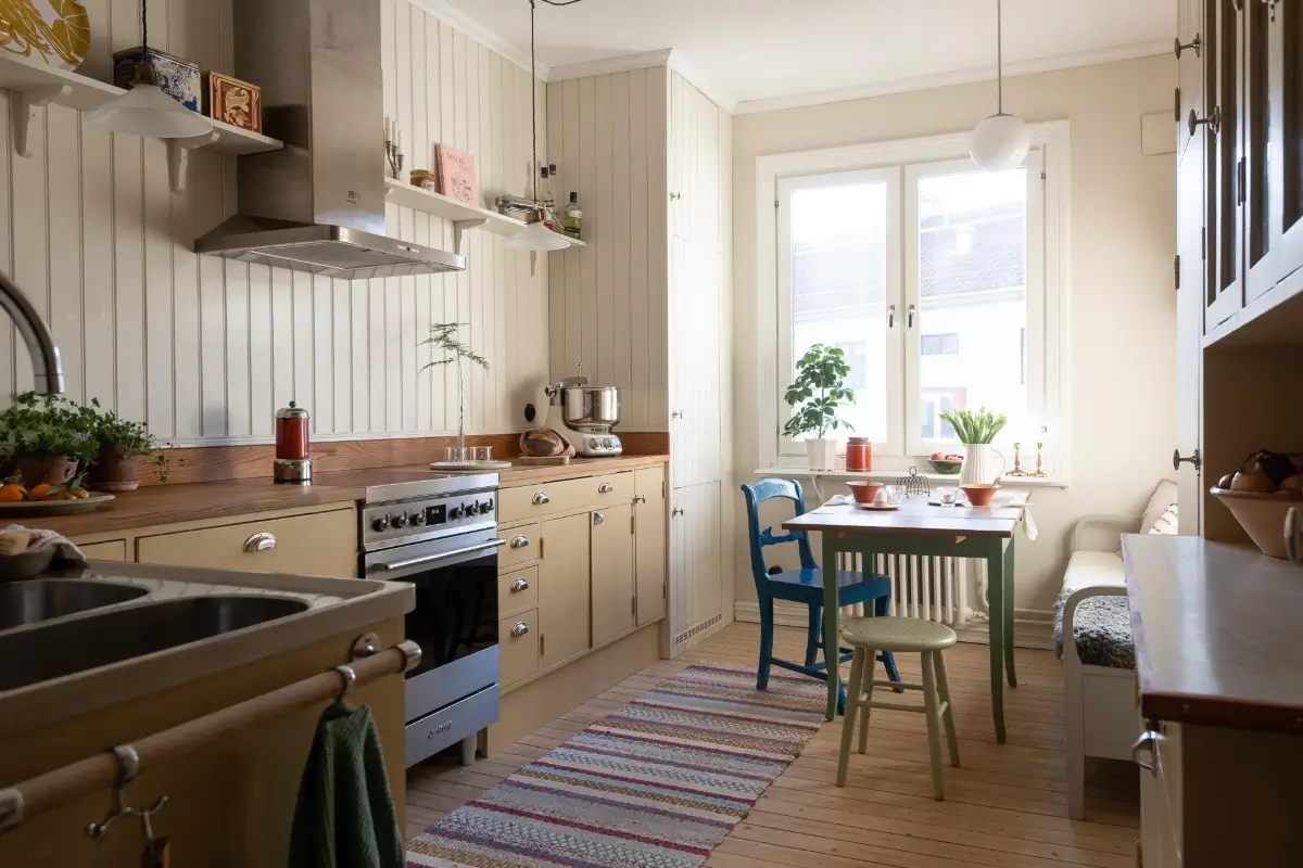 Preserved Details and a Warm Yellow Kitchen in a 1920s Apartment 1 yellow-kitchen-light-blue-living-room-ceiling-swedish-apartment