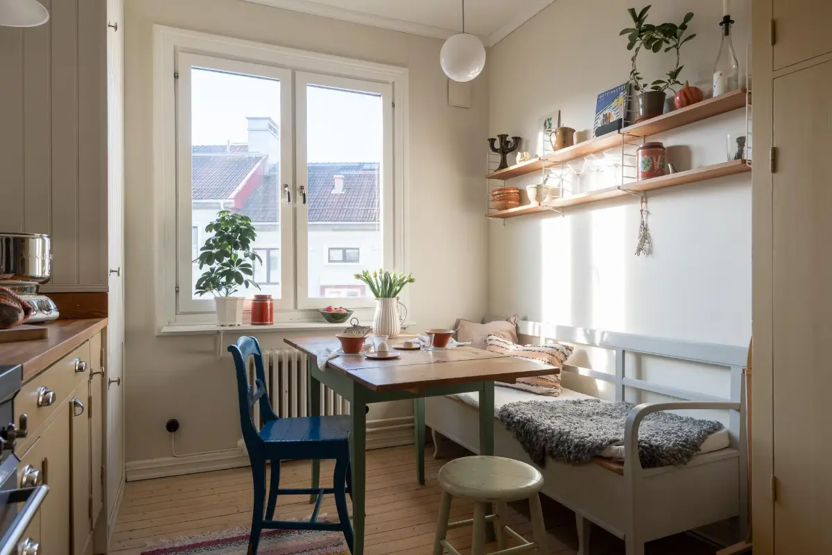 Preserved Details and a Warm Yellow Kitchen in a 1920s Apartment 3 yellow-kitchen-light-blue-living-room-ceiling-swedish-apartment