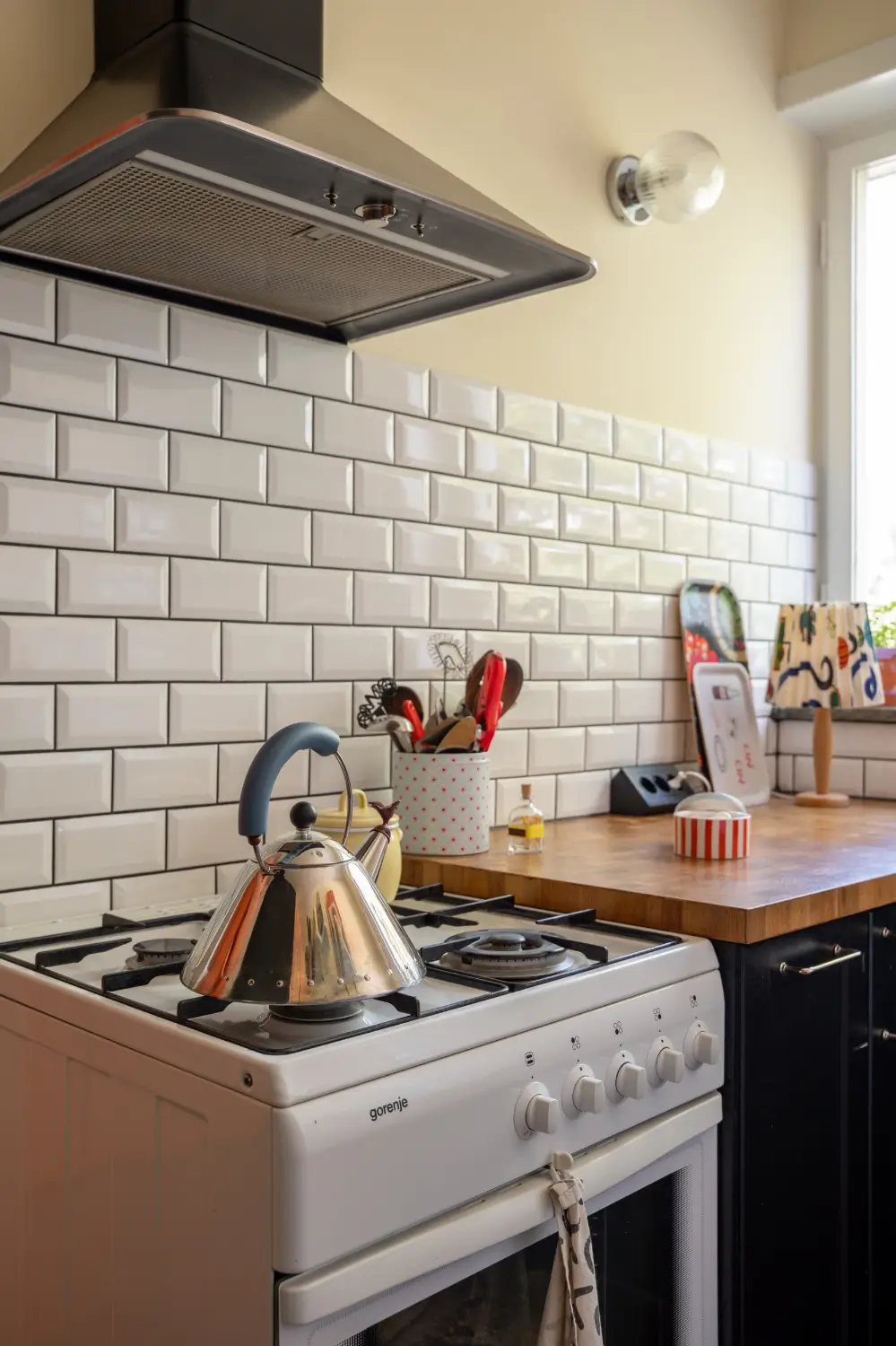 Cheerful Colors in a Small & Light 1940s Apartment in Stockholm 25 kitchen-detail-white-backsplash-tiles