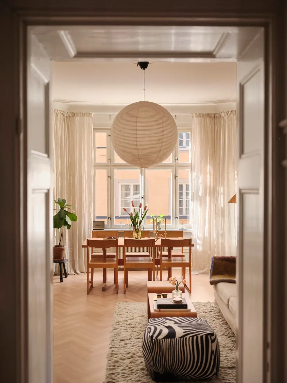A Decorative Fireplace and Classic Touches in a 592 sq ft Stockholm Apartment 8 large-windows-period-features-renovated-early-20th-century-apartment-nordroom