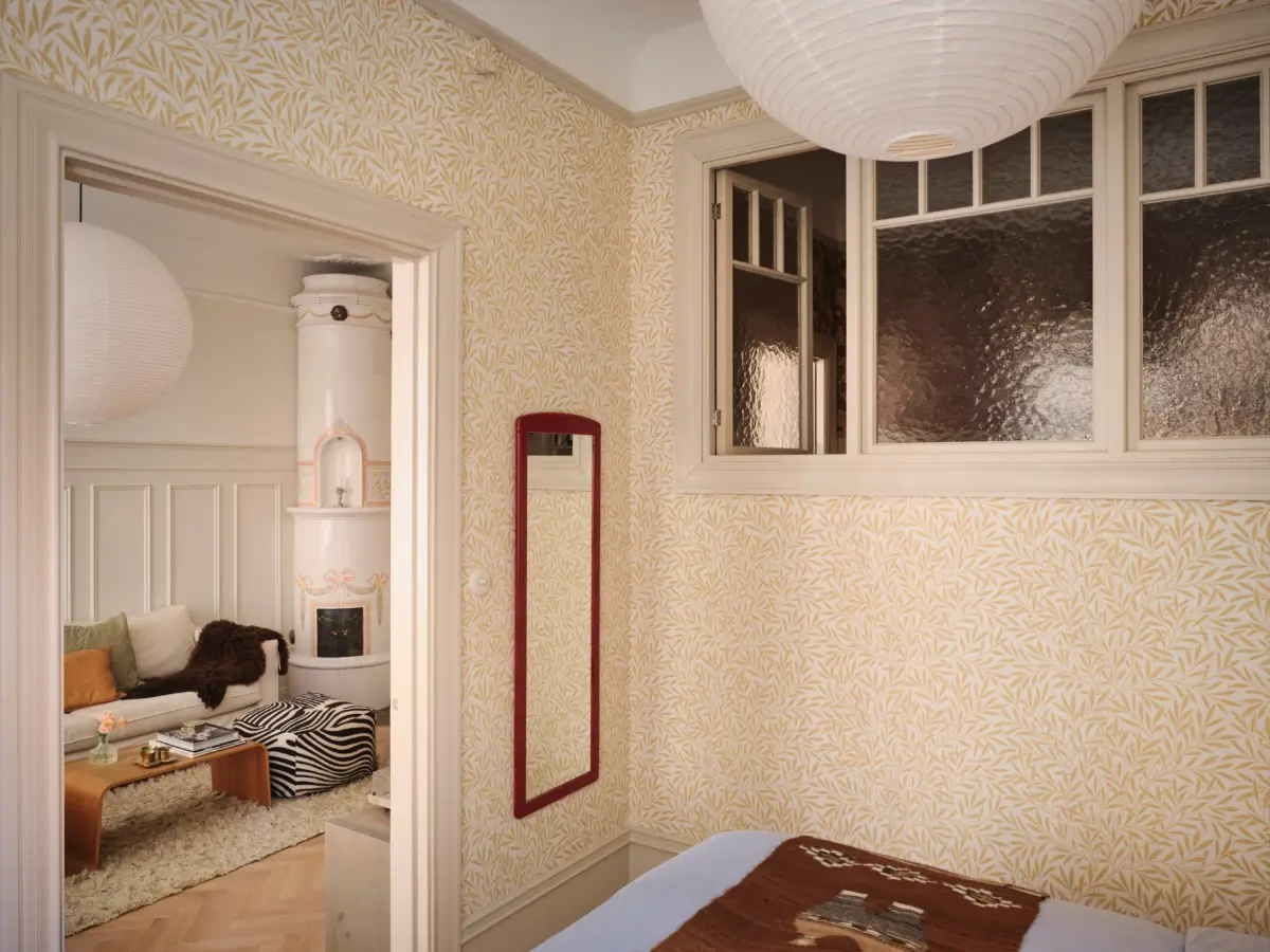 A Decorative Fireplace and Classic Touches in a 592 sq ft Stockholm Apartment 12 large-windows-period-features-renovated-early-20th-century-apartment-nordroom