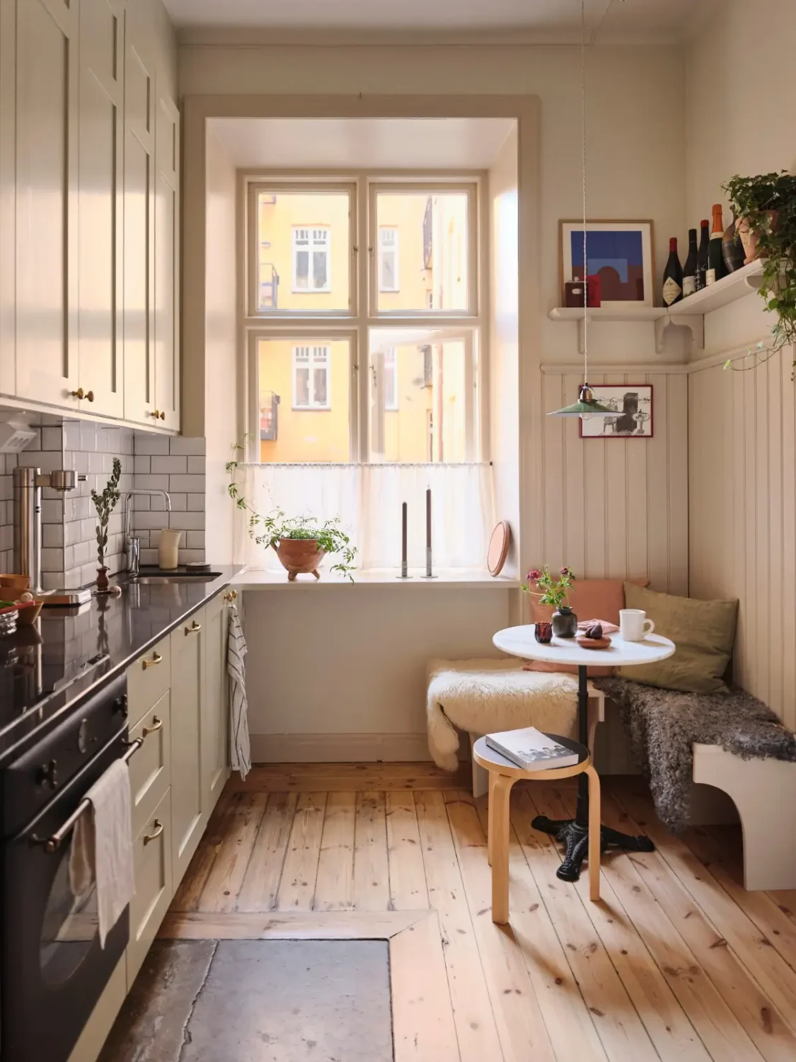 A Decorative Fireplace and Classic Touches in a 592 sq ft Stockholm Apartment 17 large-windows-period-features-renovated-early-20th-century-apartment-nordroom