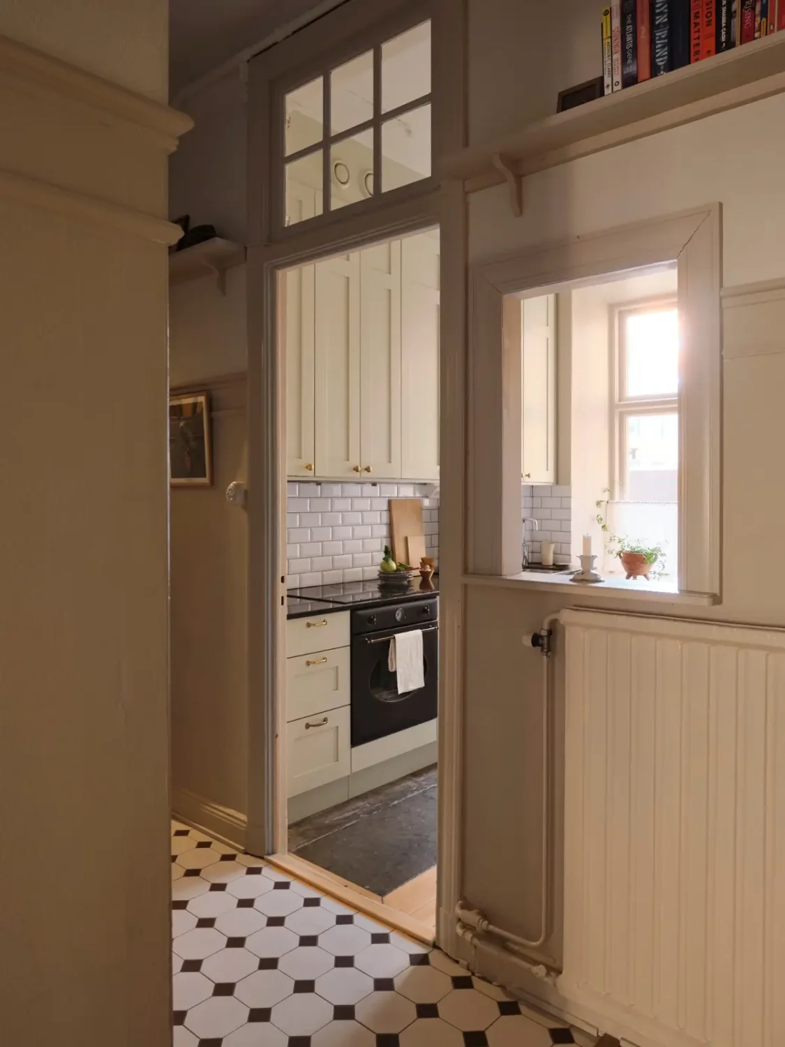 A Decorative Fireplace and Classic Touches in a 592 sq ft Stockholm Apartment 23 large-windows-period-features-renovated-early-20th-century-apartment-nordroom