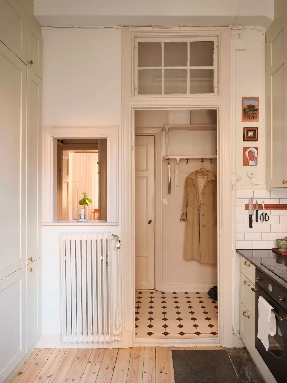 A Decorative Fireplace and Classic Touches in a 592 sq ft Stockholm Apartment 22 large-windows-period-features-renovated-early-20th-century-apartment-nordroom