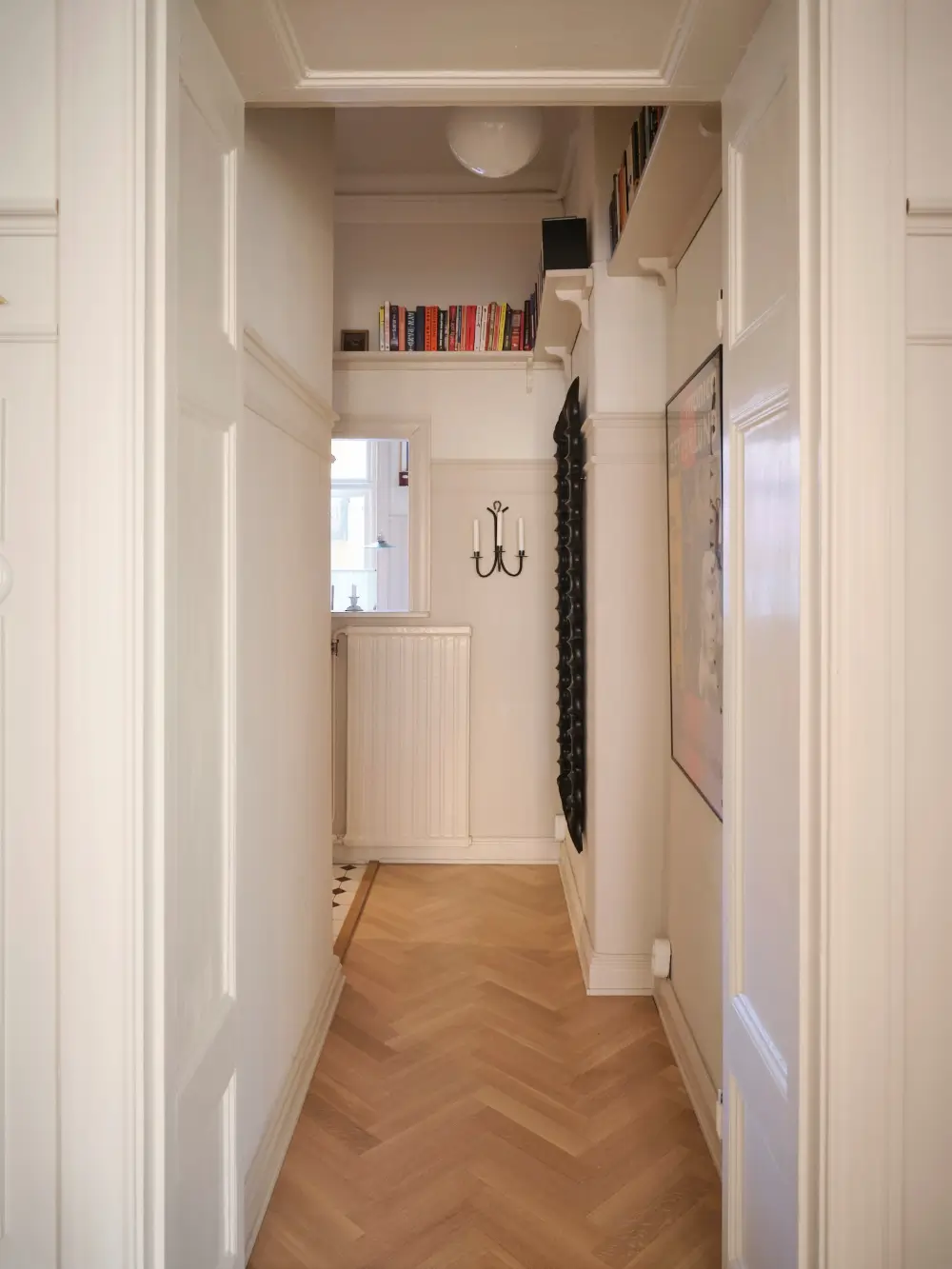 A Decorative Fireplace and Classic Touches in a 592 sq ft Stockholm Apartment 24 large-windows-period-features-renovated-early-20th-century-apartment-nordroom