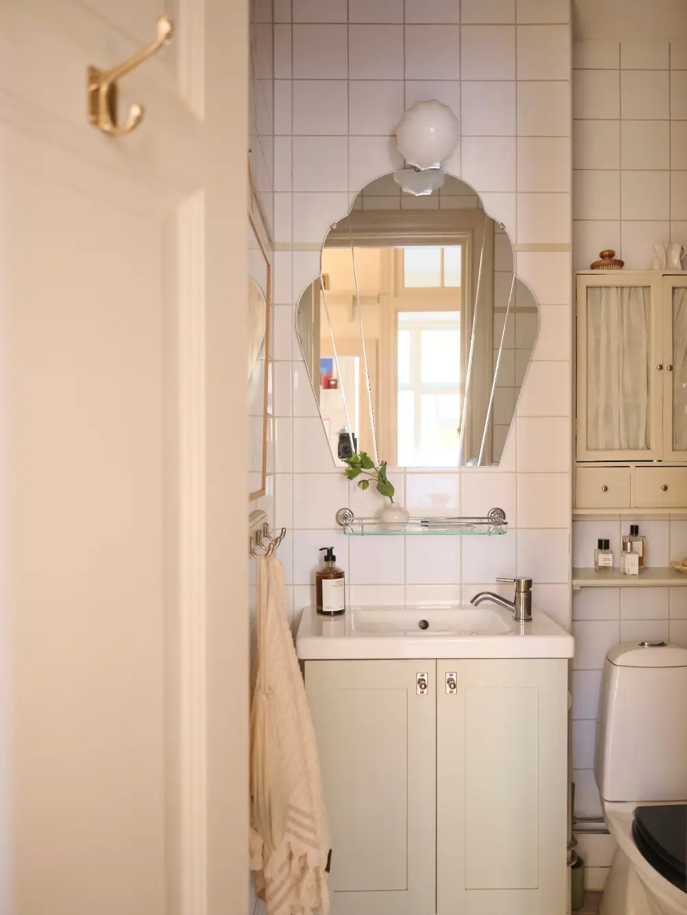 A Decorative Fireplace and Classic Touches in a 592 sq ft Stockholm Apartment 25 large-windows-period-features-renovated-early-20th-century-apartment-nordroom
