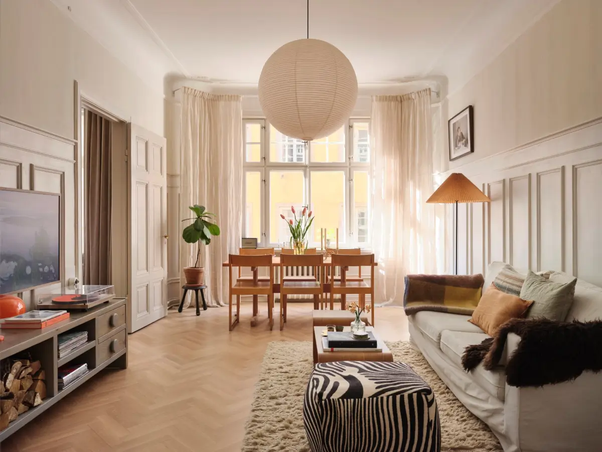 A Decorative Fireplace and Classic Touches in a 592 sq ft Stockholm Apartment 2 large-windows-period-features-renovated-early-20th-century-apartment-nordroom