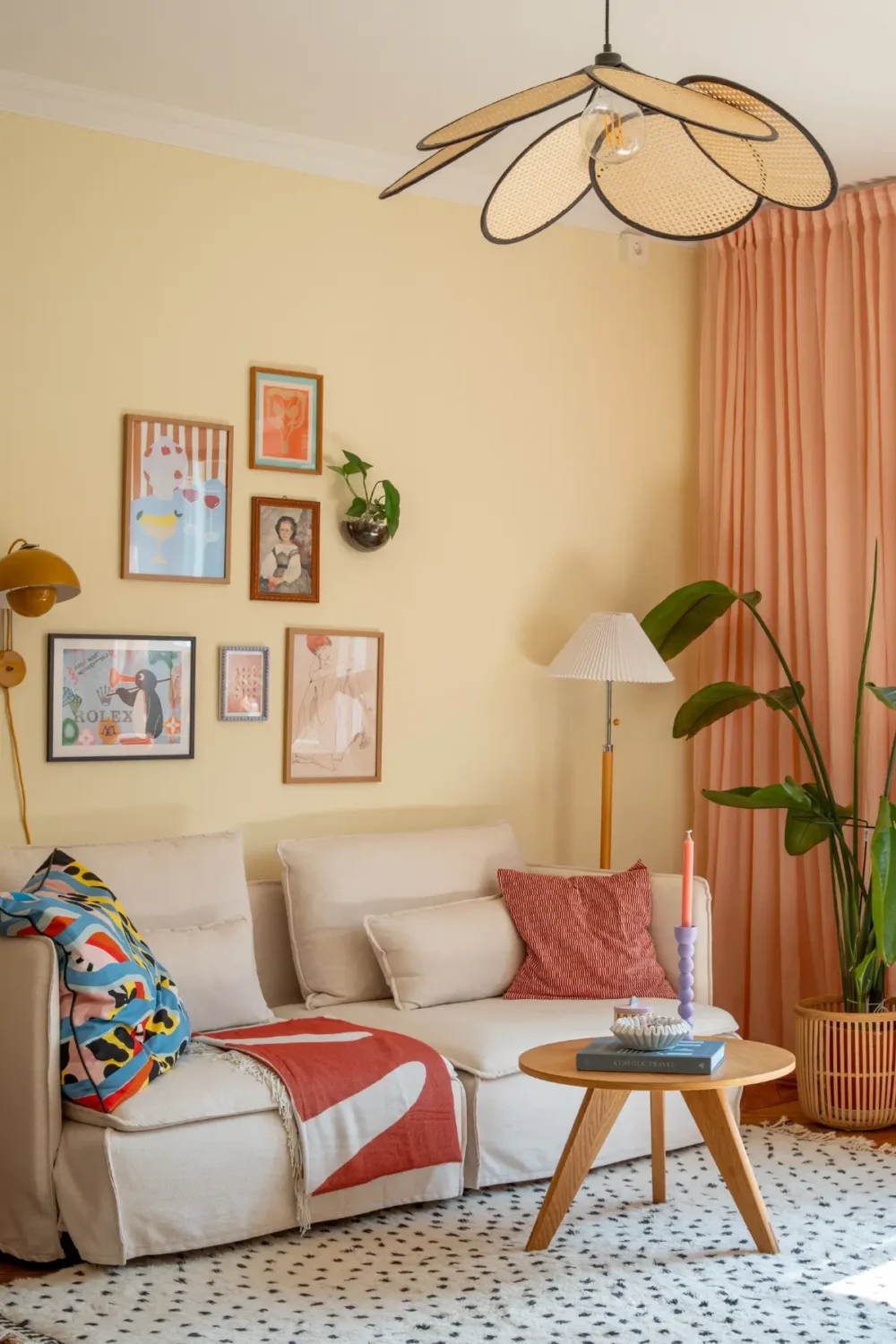 Cheerful Colors in a Small & Light 1940s Apartment in Stockholm 6 living room light yellow walls pink curtains