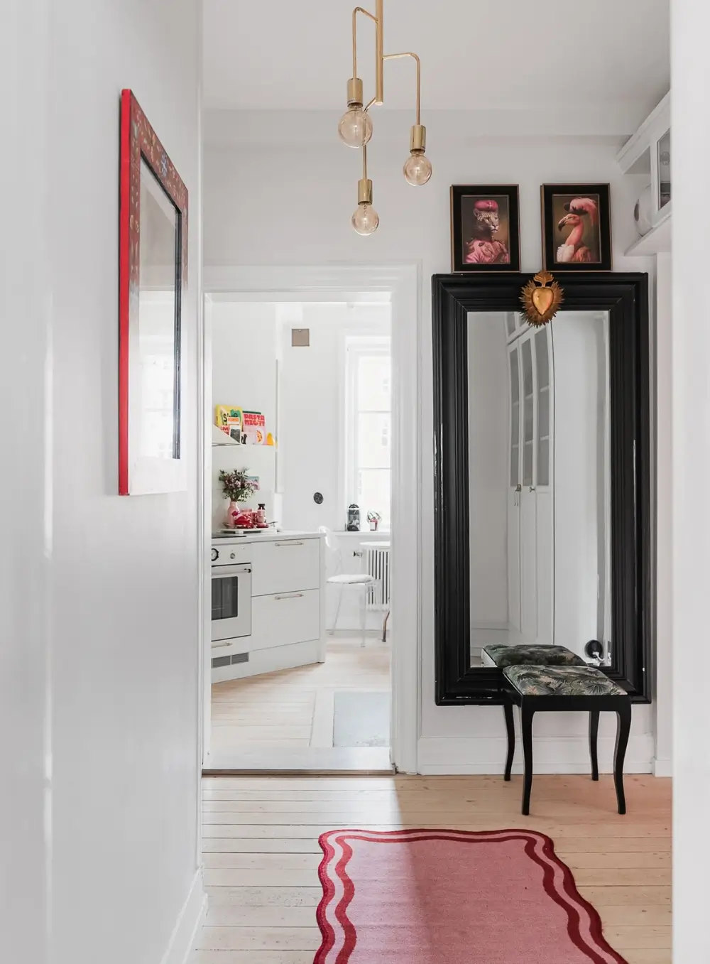 Whimsical Decor and Vibrant Color Accents in a Malmö Apartment 5 hall-pink-rug