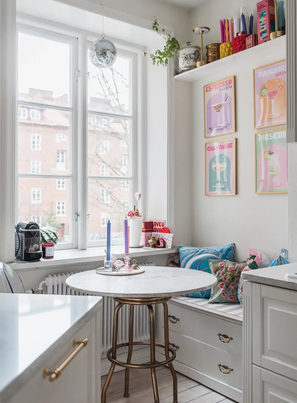 Whimsical Decor and Vibrant Color Accents in a Malmö Apartment 8 kitchen-breakfast-nook-storage-bench
