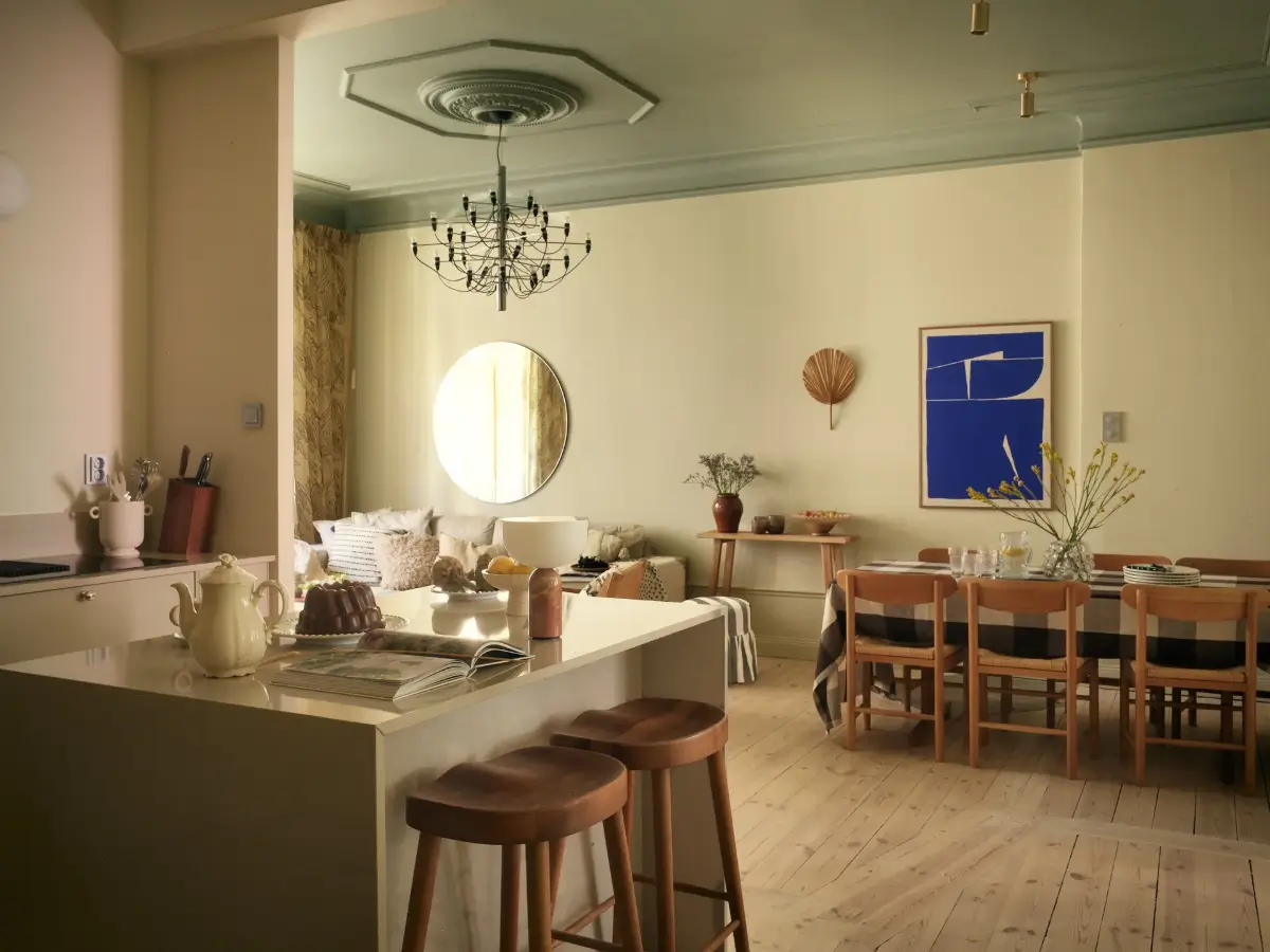 A Serene Color Palette and an Open-Plan Living Space in a Stockholm Apartment 13 open-plan-living-space-painted-ceiling-turn-of-the-century-stockholm-apartment-nordroom