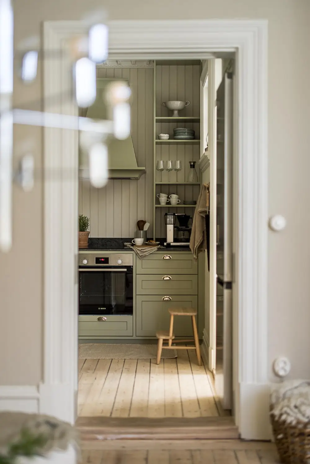 A Green Kitchen, Period Elements, and Jotun Colors in a Small Corner Apartment 7 renovated-late-19th-century-corner-apartment-gothenburg-nordroom